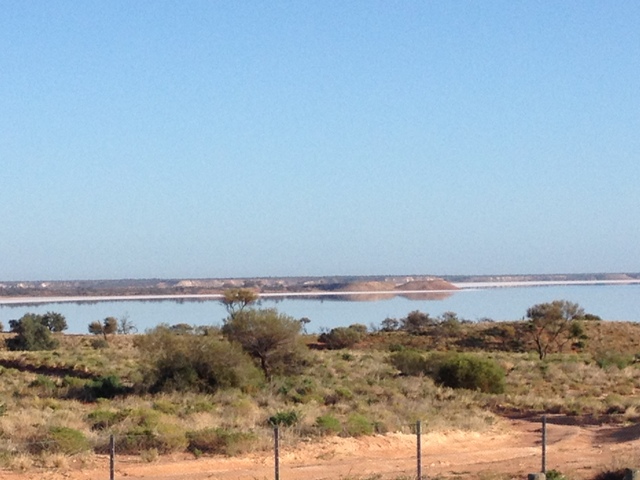 Lake Hart under a clear blue sky. Remember, it's not water, it's salt!